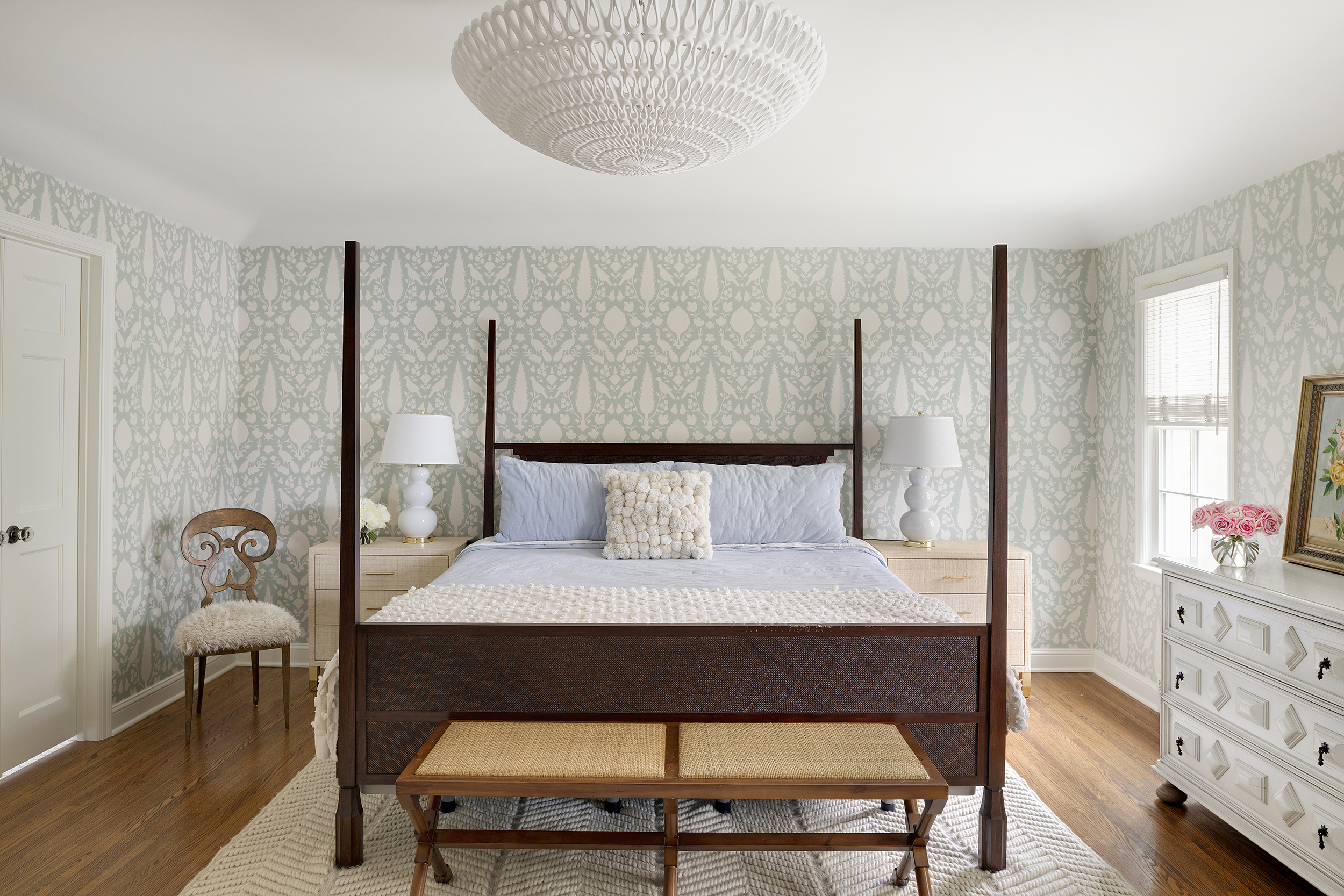 Calm transitional primary bedroom with patterned wallpaper in Edina, MN