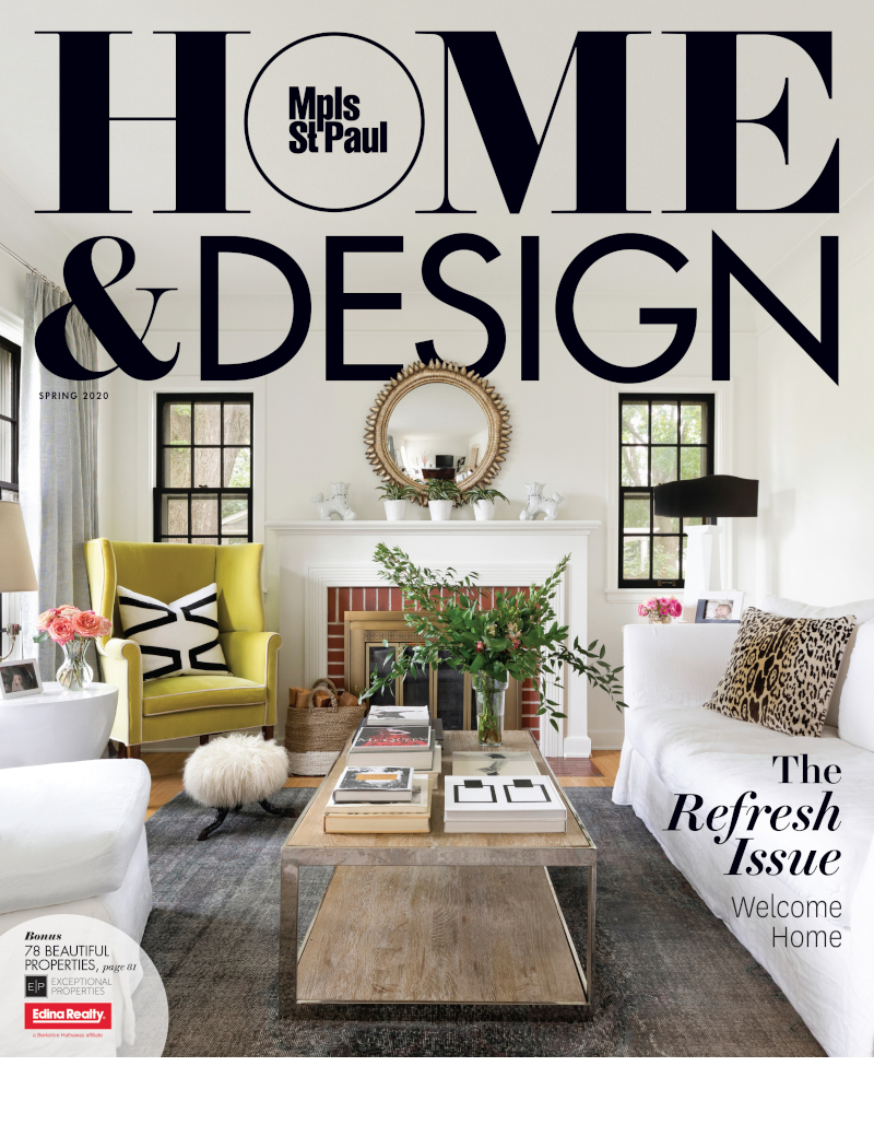 Cover page of Minneapolis St. Paul Magazine Spring 2020 Home & Design Issue with a white living room with a white sofa, chair and yellow chair in front of a traditional fireplace with a round mirror above the mantle.